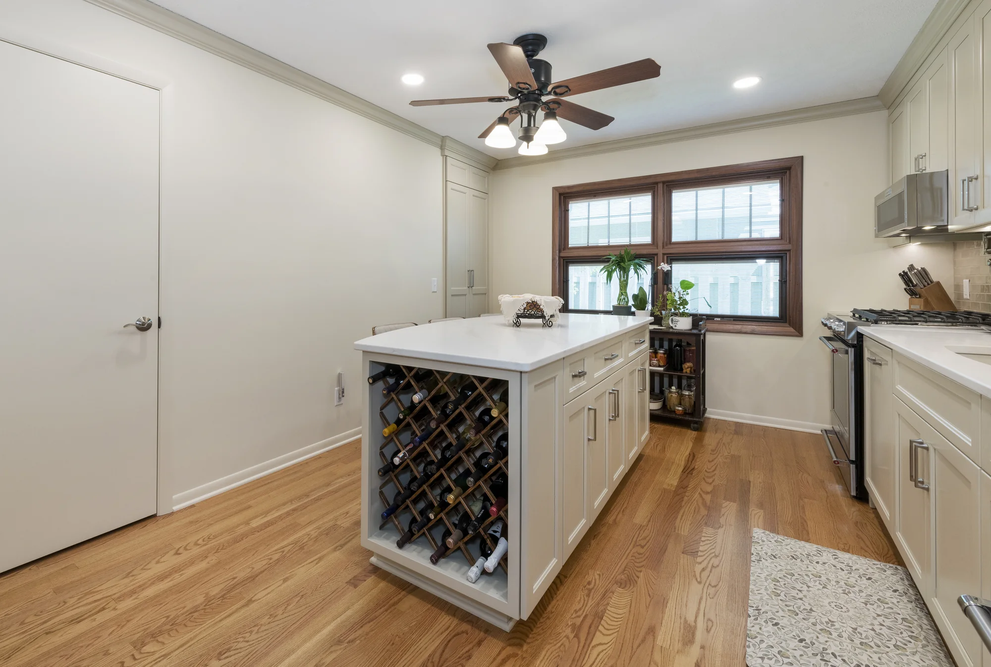Kitchen island viewed toward its integrated wine rack