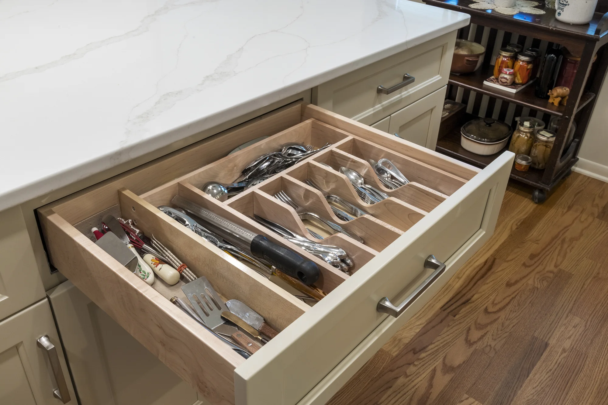 Custom divided utensil drawer inside the island