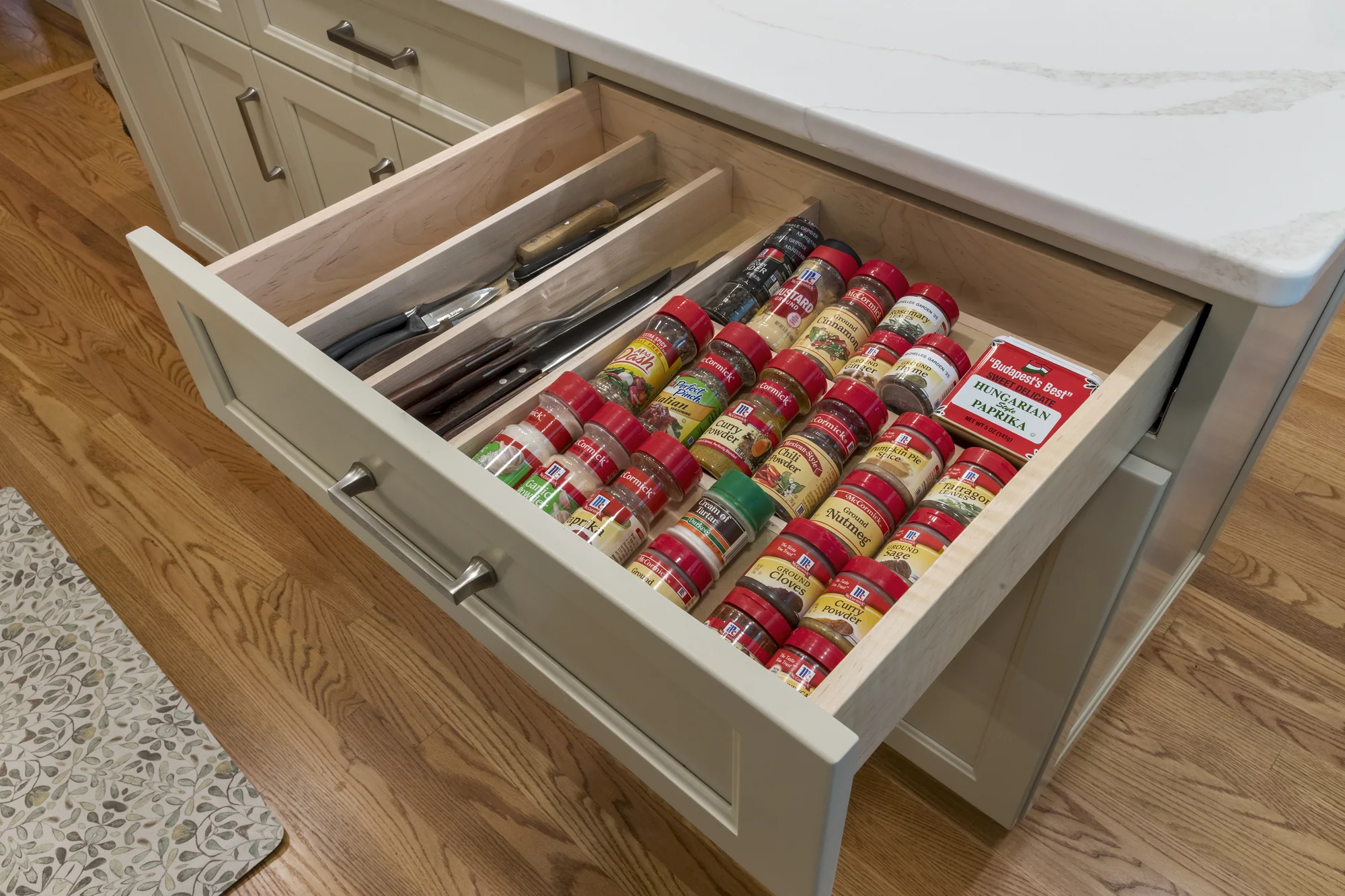 Organized spice drawer beneath the island countertop