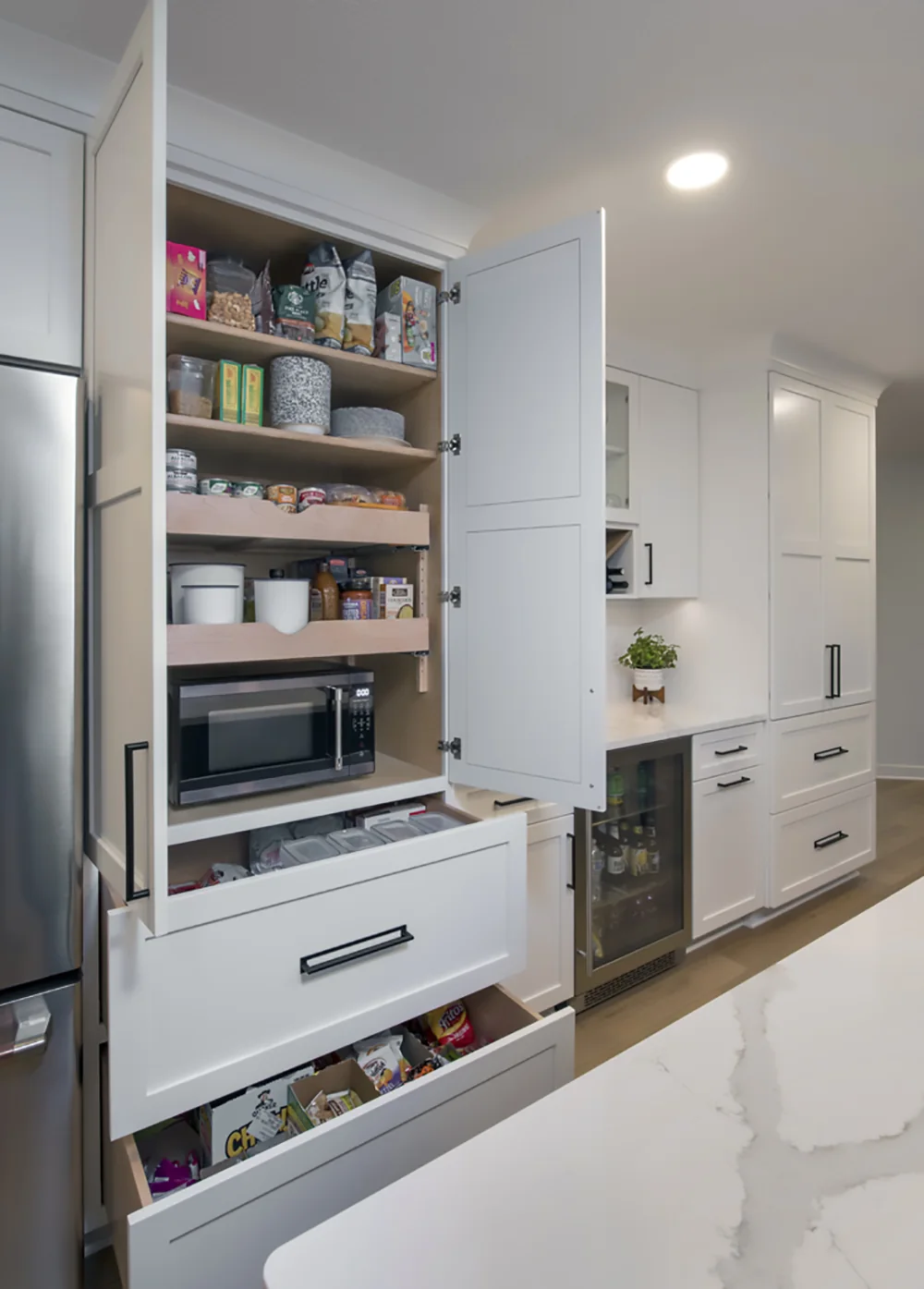 Open pantry cabinet with pull-out storage