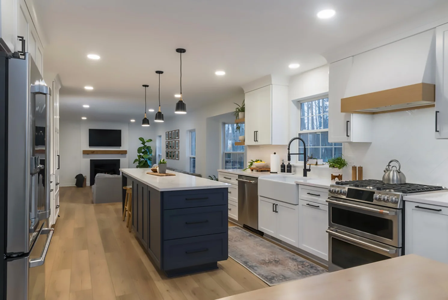Deep blue island surrounded by white cabinetry