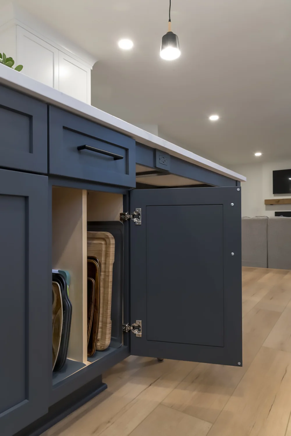 Open cabinet storage built into the blue island
