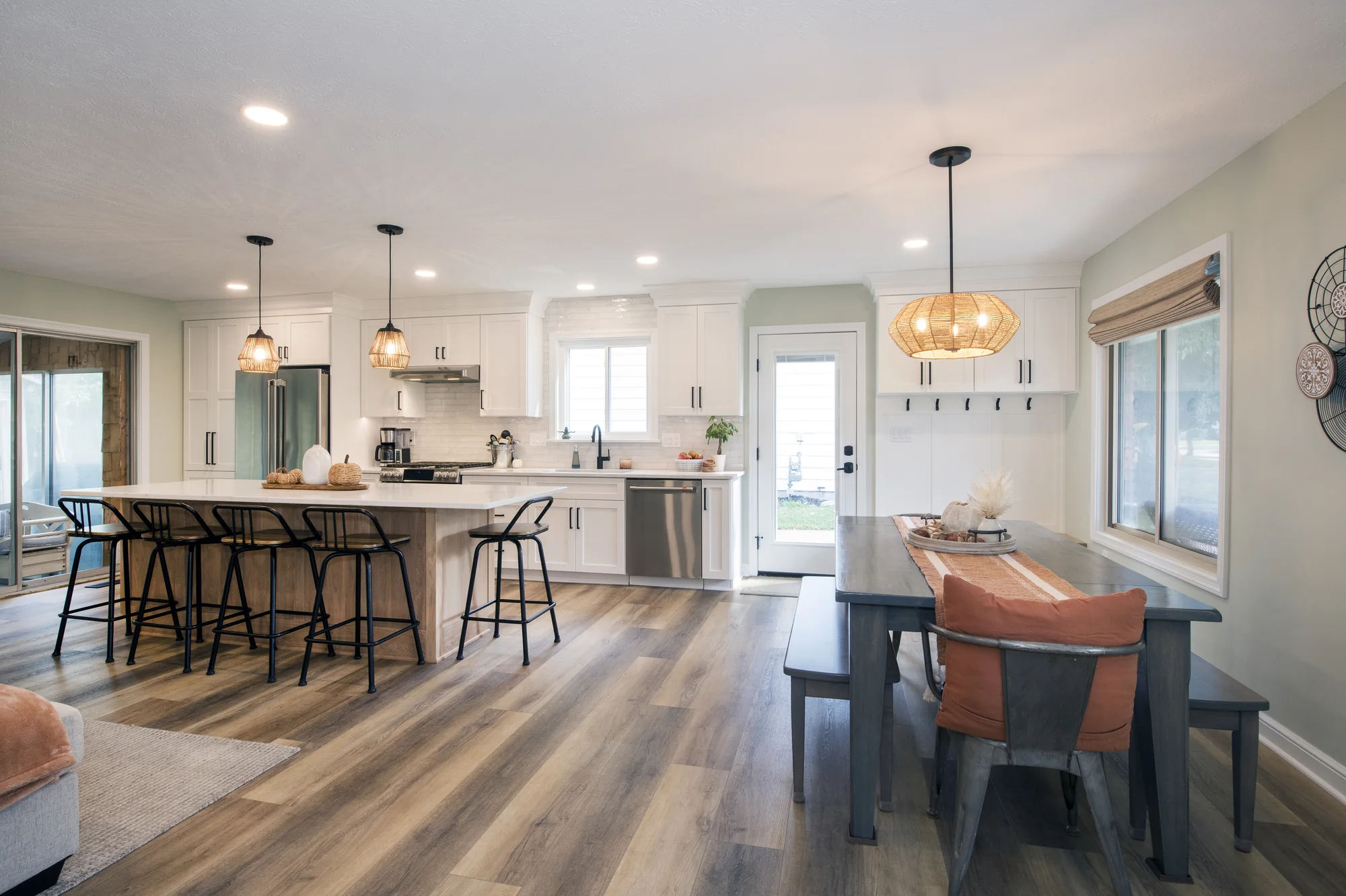 Kitchen and dining spaces viewed across the open floor plan