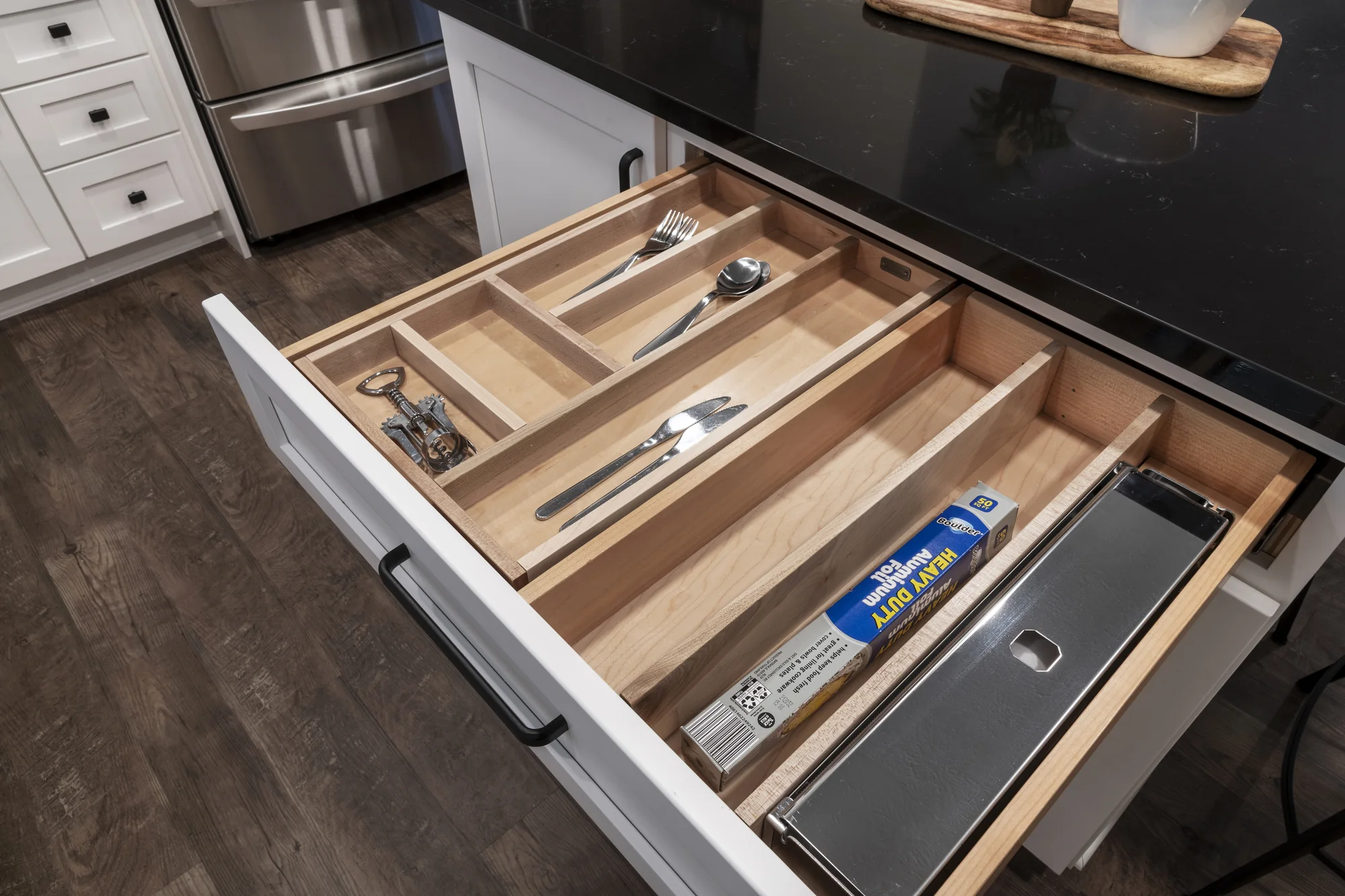 Custom divided drawer for utensils and kitchen wrap
