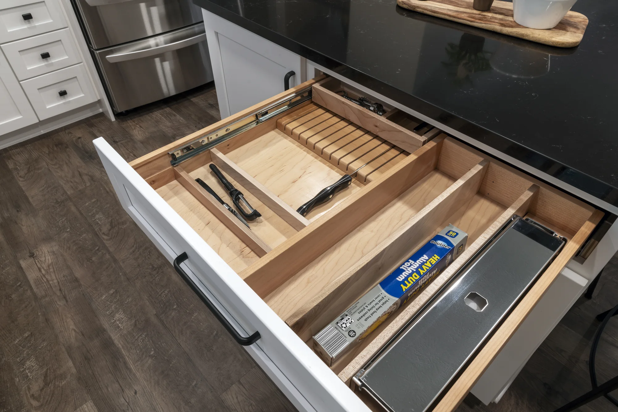 Custom utensil drawer with sliding wood organizer