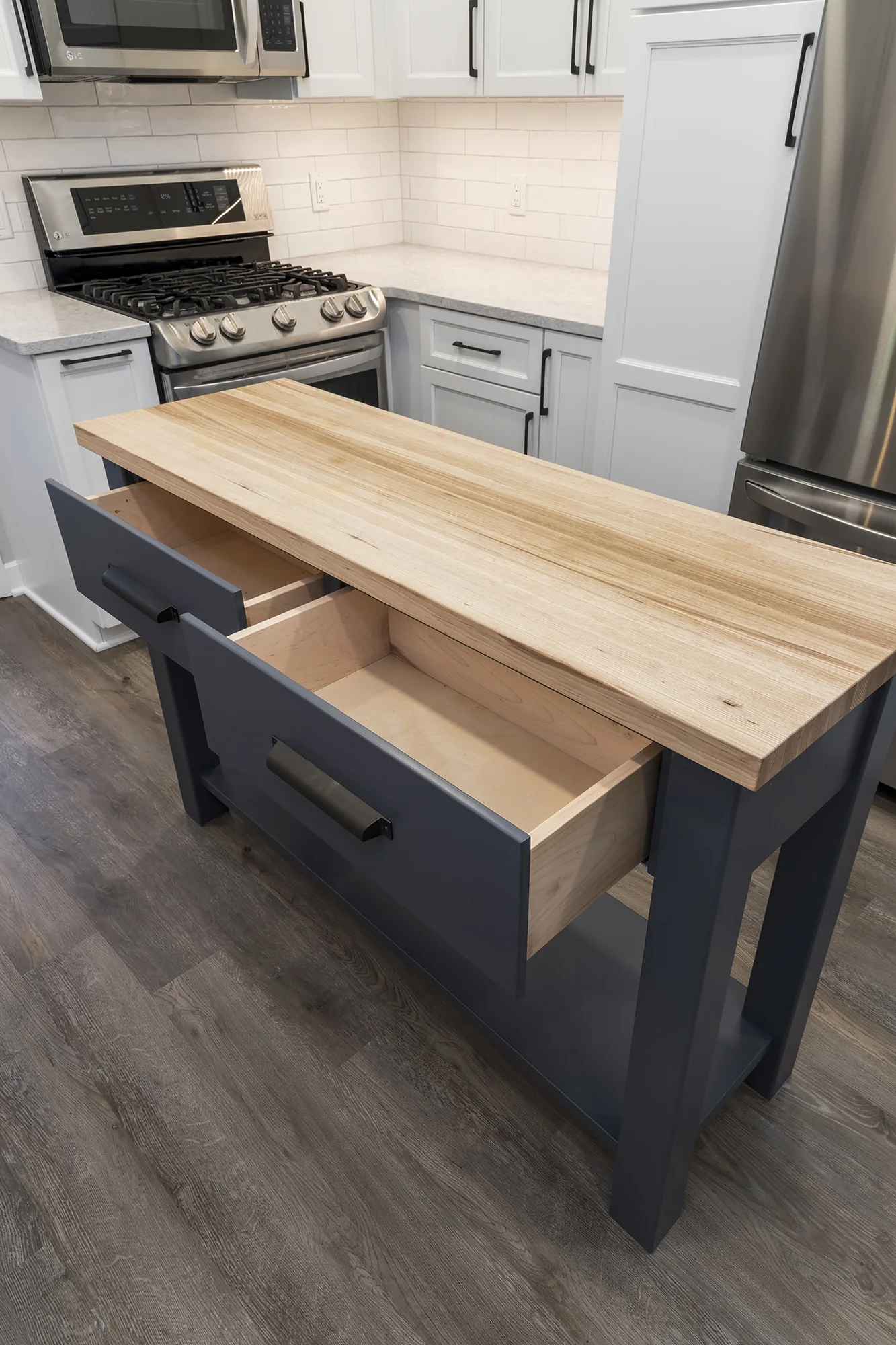 Open drawers built into the kitchen worktable island