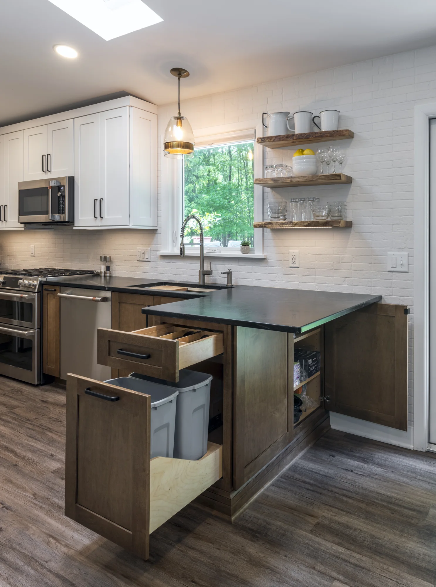 Two-tone kitchen island with open drawers and built-in storage