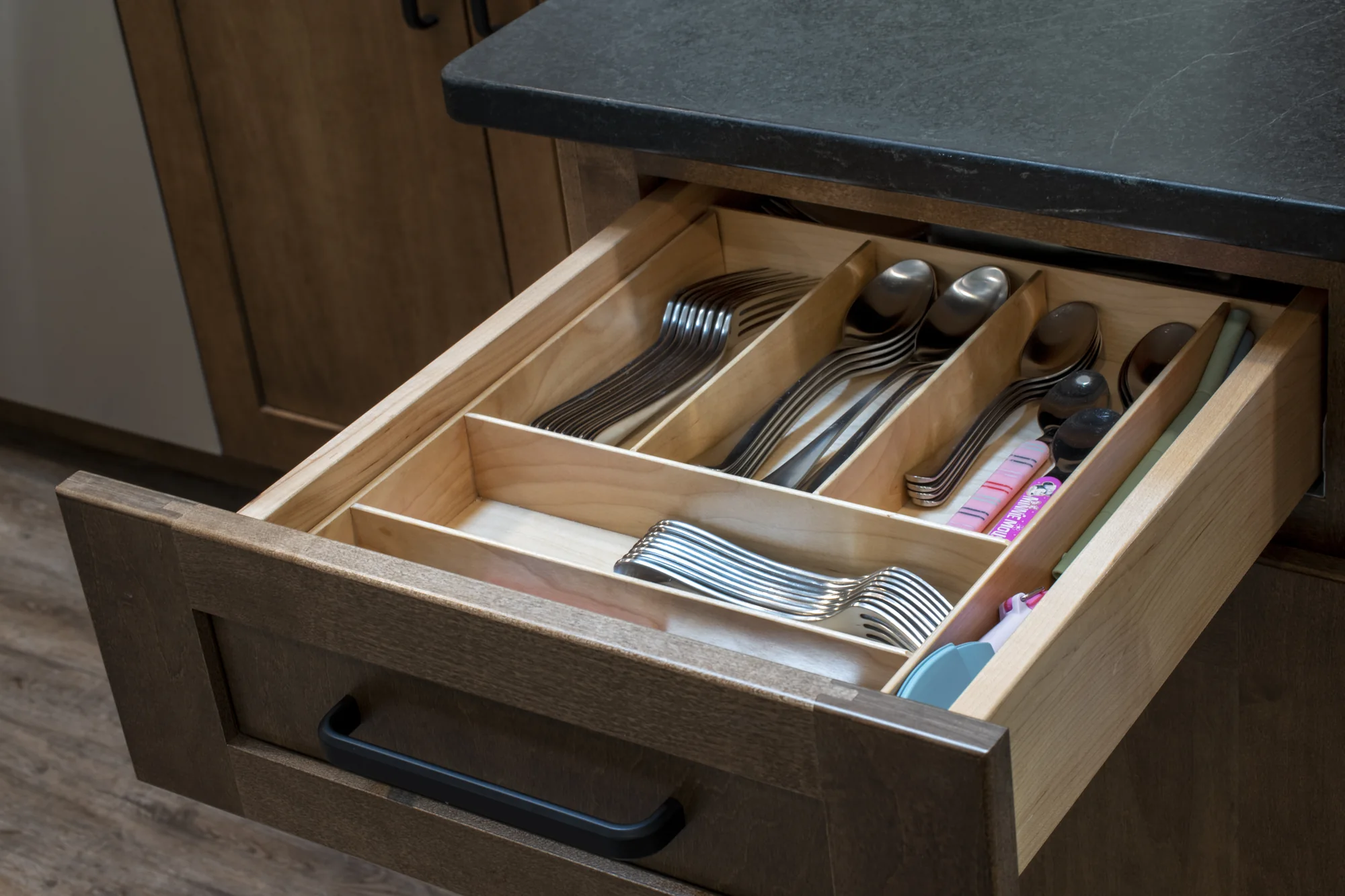 Organized utensil drawer with custom wood dividers
