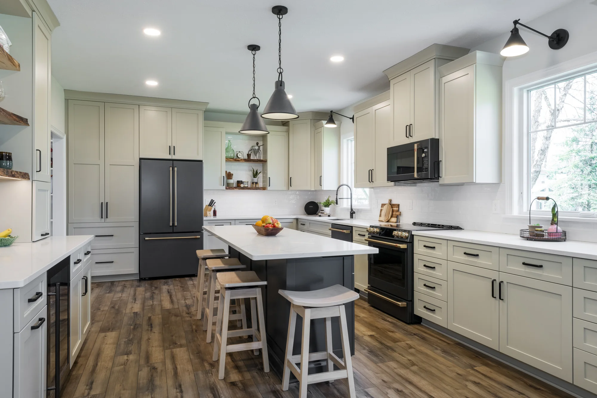 Warm kitchen with a dark island and bold black accents in Olmsted Falls