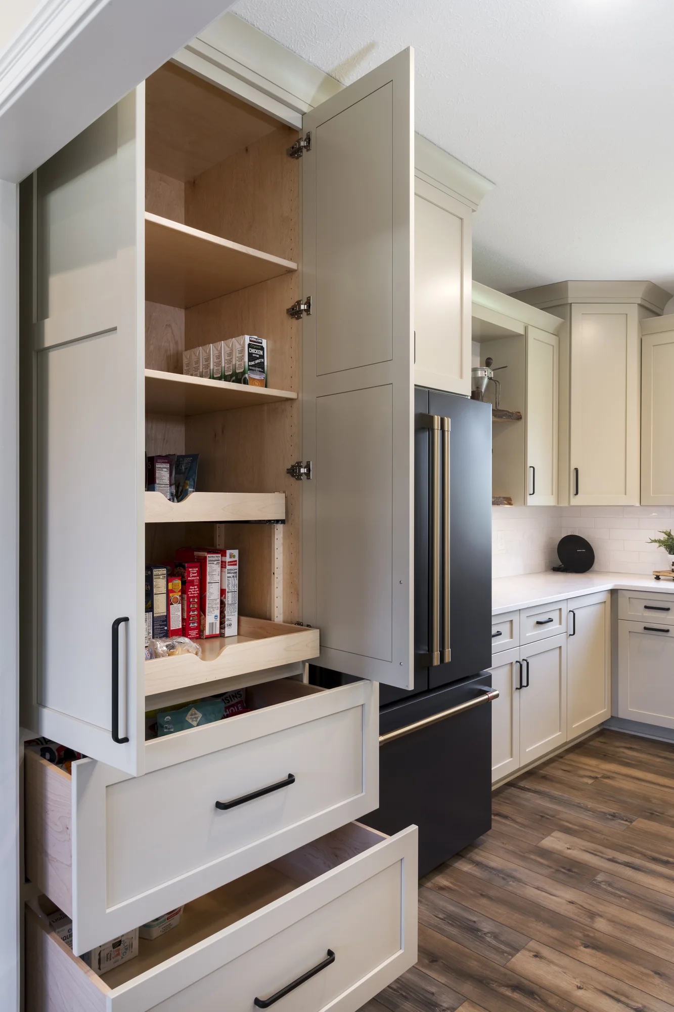 Tall pantry cabinet with its storage open