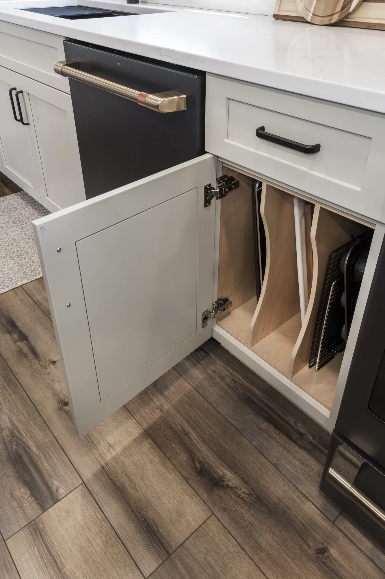 Vertical tray storage beside a black appliance
