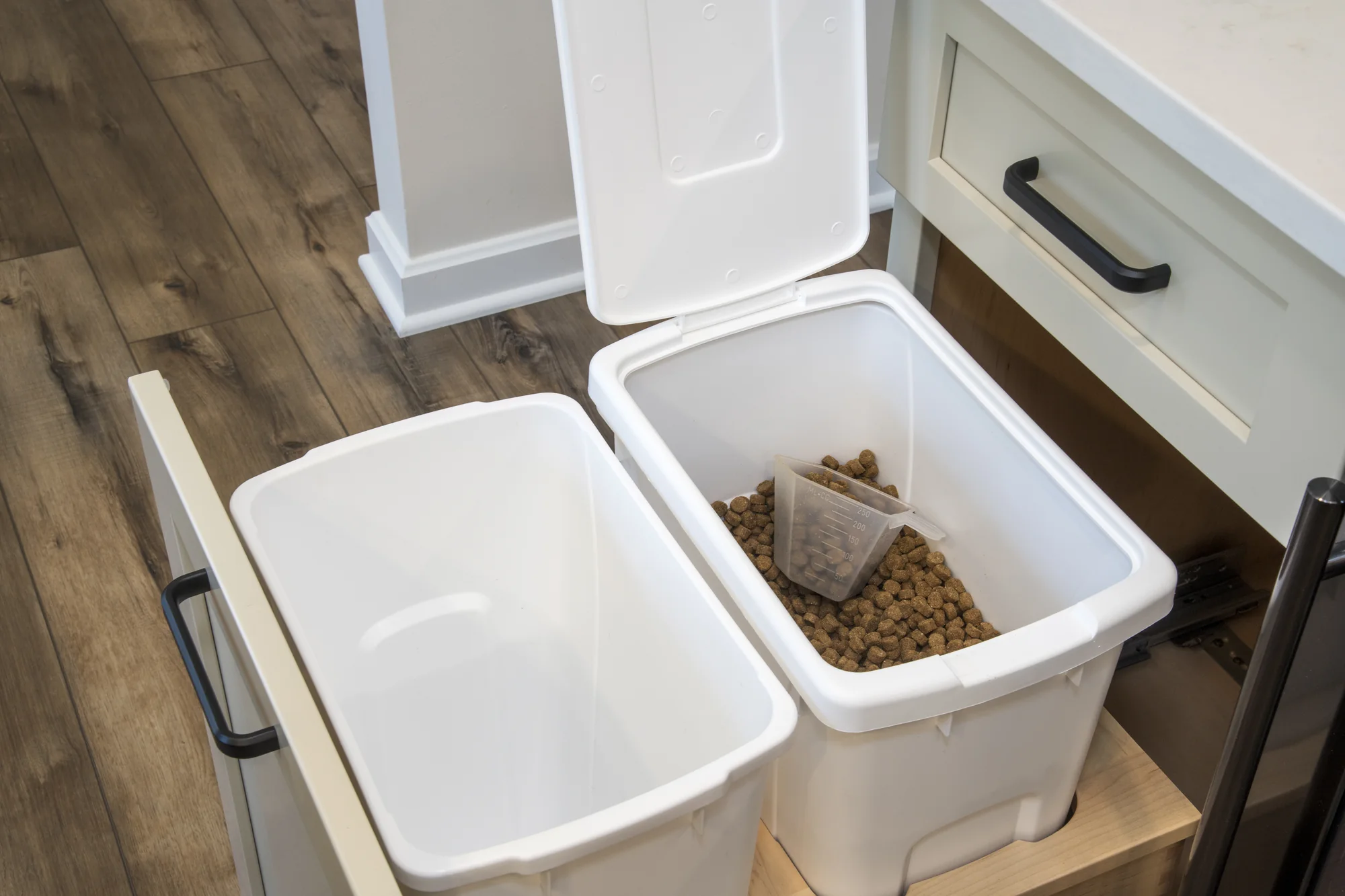 Integrated pull-out waste and recycling bins